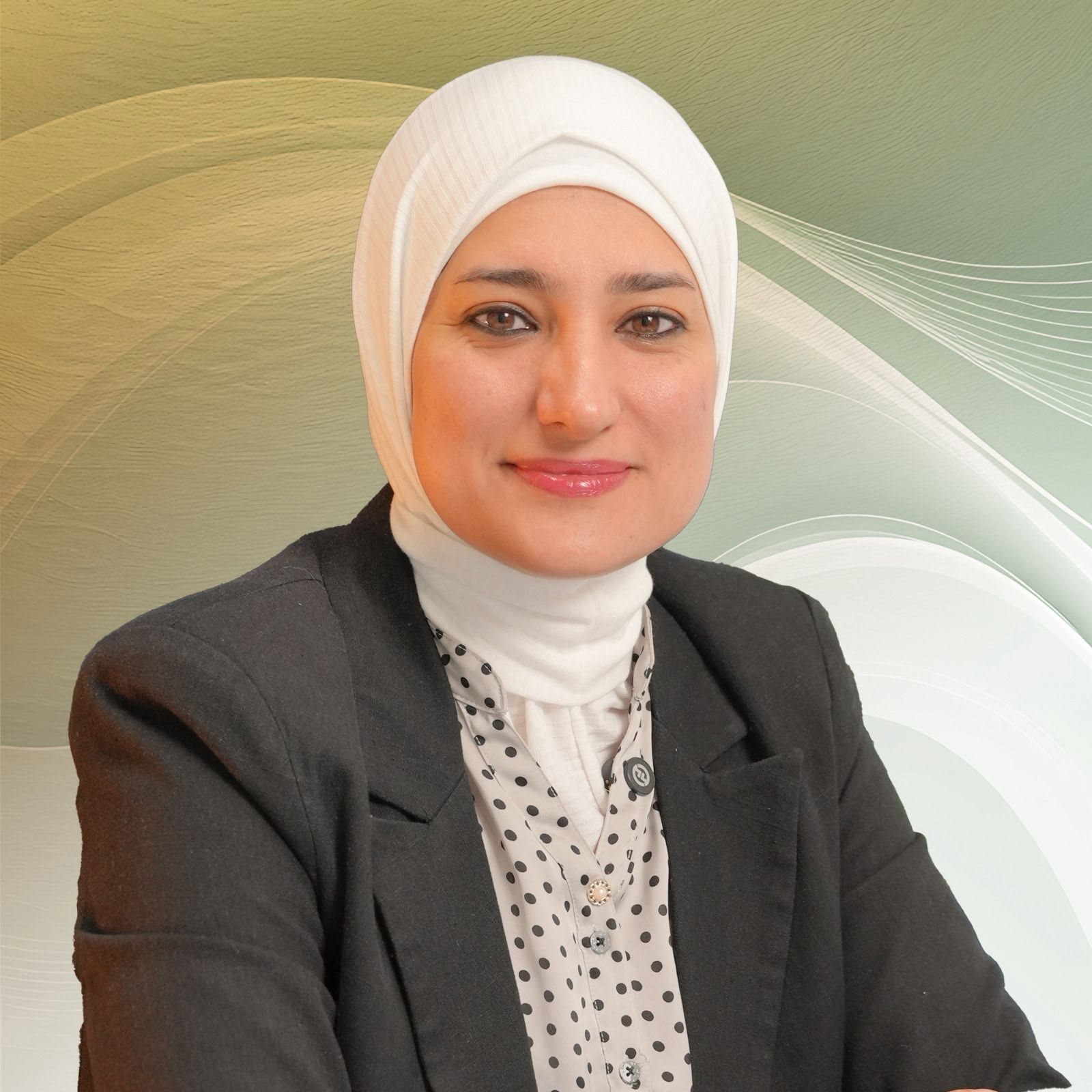 صورة شخصية للدكتورة زهراء عقيل الأنصاري بالحجاب الأبيض